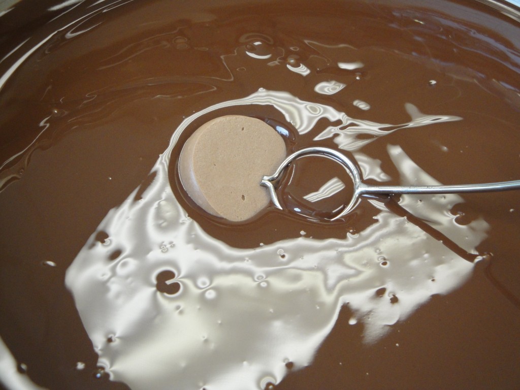 dipping truffles in tempered chocolate